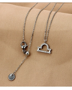 Detail of Libra zodiac pendant with zircons and adjustable slider clasp chain