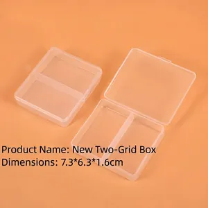 Close-up of clear 2-compartment plastic storage box measuring 7.3x6.3x1.6cm with snap lids