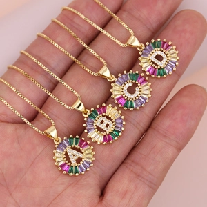 Golden box chain necklace featuring round pendants with colorful zircon initials A B C D