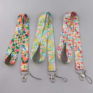 Detail of floral lanyard with quick-release metal buckle and diverse flower patterns