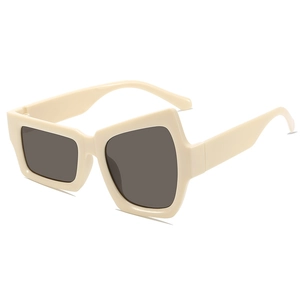 Lunettes de soleil à monture beige épaisse irrégulière avec verres gris foncé tendance