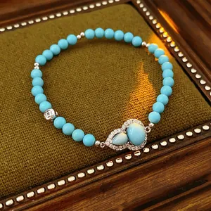 Vintage turquoise beaded bracelet with blue gourd charms and silver crystal accents