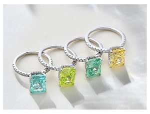 Detail of four S925 sterling silver rings with colorful radiant cut square gemstones