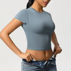 Close-up of slim fit cropped sports top showing high-elasticity fabric and side seams