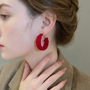 Elegant red fabric pleated round hoop earrings with silver pins for a vintage look