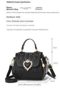 Close-up of quilted water ripple texture and golden crown heart metal buckle on black bag