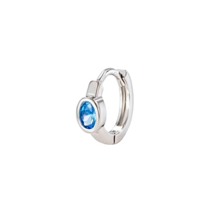 Elegant silver ear buckle with oval blue zircon and refined geometric edges on white background