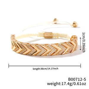 Detail showing 1cm wide V-shaped arrow bracelet with pave rhinestones and LOVE engraving