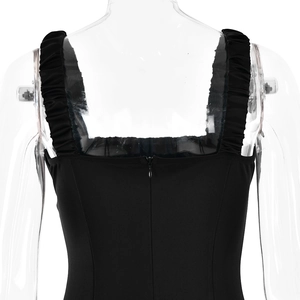 Detail of the back view showing pleated straps and invisible zipper on black dress