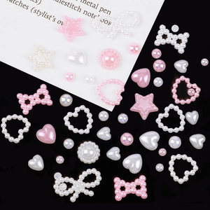 Pink and white resin nail charms featuring bows, stars and hearts in a mixed variety set