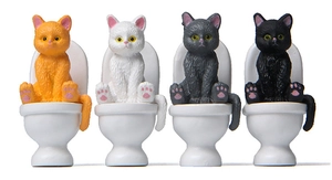 Detailed set of four miniature resin cats sitting on toilets for creative garden landscaping