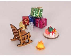 Miniature Christmas set with wooden rocking chair, gift boxes, and campfire on base