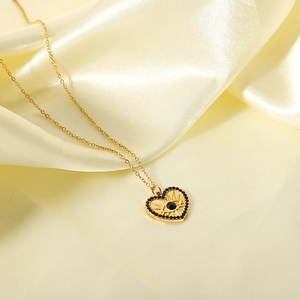 18K gold plated stainless steel heart necklace with black evil eye pendant on silk