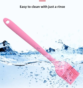 Pink silicone pastry brush showing flexible bristles and easy-to-clean waterproof design