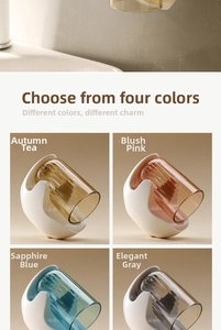 Detail view of magnetic wall-mounted toothbrush cups in four transparent color options