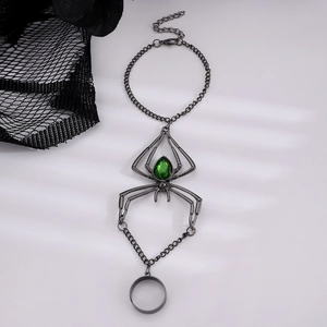 Gothic spider ring bracelet with green crystal gems and gunmetal chains for Halloween
