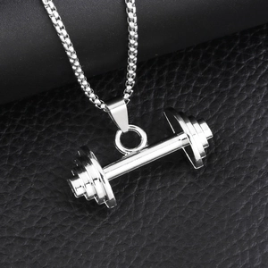Men's hip hop silver dumbbell pendant necklace on black leather texture background