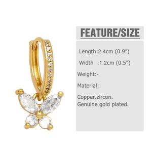 Detail view of gold butterfly earrings with zircon stones and dimensions 2.4cm by 1.2cm