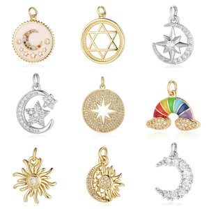 Set of nine assorted celestial charms including gold sun moon star and rainbow pendants