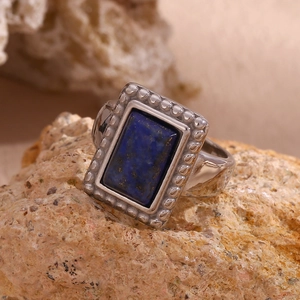 Macro detail of retro 18K gold plated ring with rectangular blue lapis lazuli stone