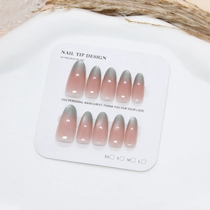 Pink and grey gradient cat-eye almond press-on nails set on a white display card