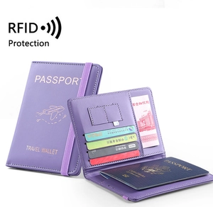 Detail of purple PU leather passport holder with RFID blocking and elastic strap