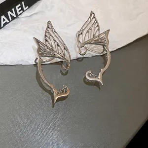 Silver butterfly elf ear cuff earrings with a hollow wing design for women