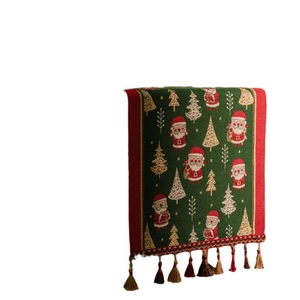 Christmas green jacquard table runner with Santa and gold tree patterns and red tassels