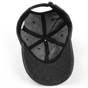 Internal view of a washed denim baseball cap showing 100% cotton lining and stitching