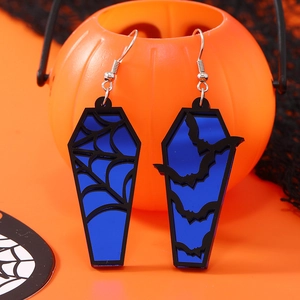 Halloween blue coffin earrings with spider web and bat patterns on festive orange background