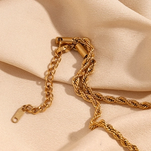 Detail of 18K gold plated twisted chain necklace with secure lobster clasp and extender