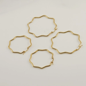 Polished 18K gold wavy stainless steel hoop earrings in large and small sizes
