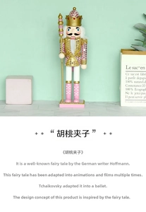 Detailed view of pink and gold 30cm wooden nutcracker with sequins and golden crown