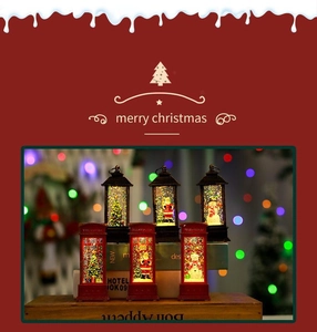 Close-up of vintage lighted Christmas telephone booth with Santa Claus inside
