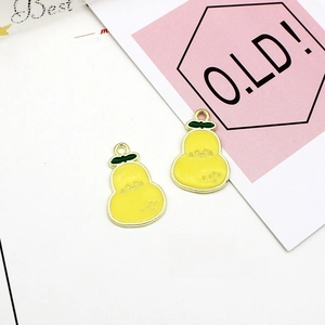 Detail showing yellow pear charm with cute face, 15mm by 22mm size and gold rim
