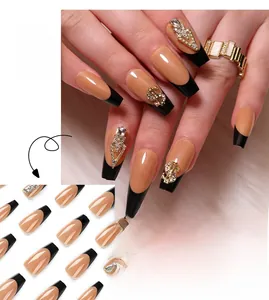 Detailed view of long ballerina press on nails with black french tips and gold dollar rhinestones