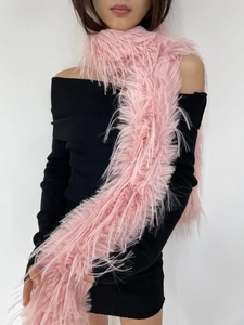 Detail shot of the plush pink faux fur scarf texture on model with soft fluffy finish