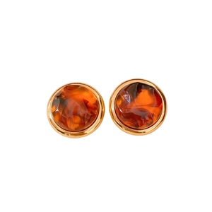 Vintage amber resin earrings with textured gold metal frames in a round stud design