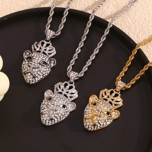 Macro shot of 18K gold and silver plated hip-hop crown leopard necklaces with crystal pave