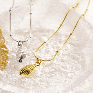 Minimalist conch shell pendant necklaces in gold and silver finish with snake bead chains