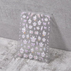 Cute cartoon nail stickers with pink cherry blossoms and white rabbits on grey background