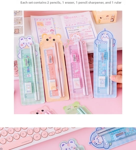 Flat lay of cute animal stationery set with pencils, ruler, and eraser on desk