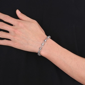 Minimalist silver stainless steel link chain bracelet for men and women on model