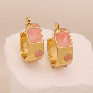 Golden geometric earrings with pink marble enamel inlay on textured stone base