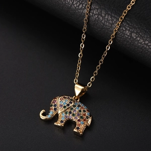 Macro detail of elephant pendant with colorful cubic zirconia on black leather
