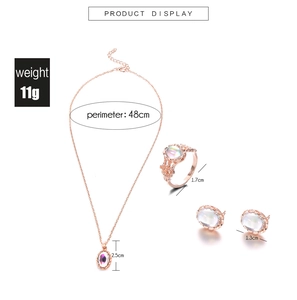 Detailed dimensions of rose gold jewelry set with opal-effect stones and filigree
