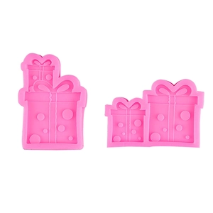 Pink silicone mold featuring bowknot gift box shapes for chocolate and pudding desserts
