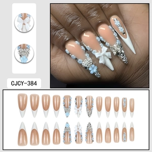 French blue flower stiletto press-on nails with white bows and sparkling rhinestones