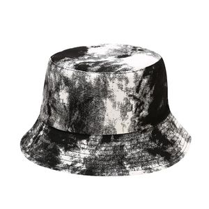 Fashionable black and white tie-dye bucket hat for sun protection with a reversible design