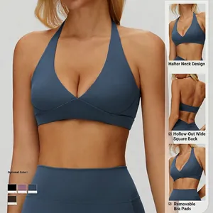 Navy blue halter neck sports bra with open back design and removable chest padding